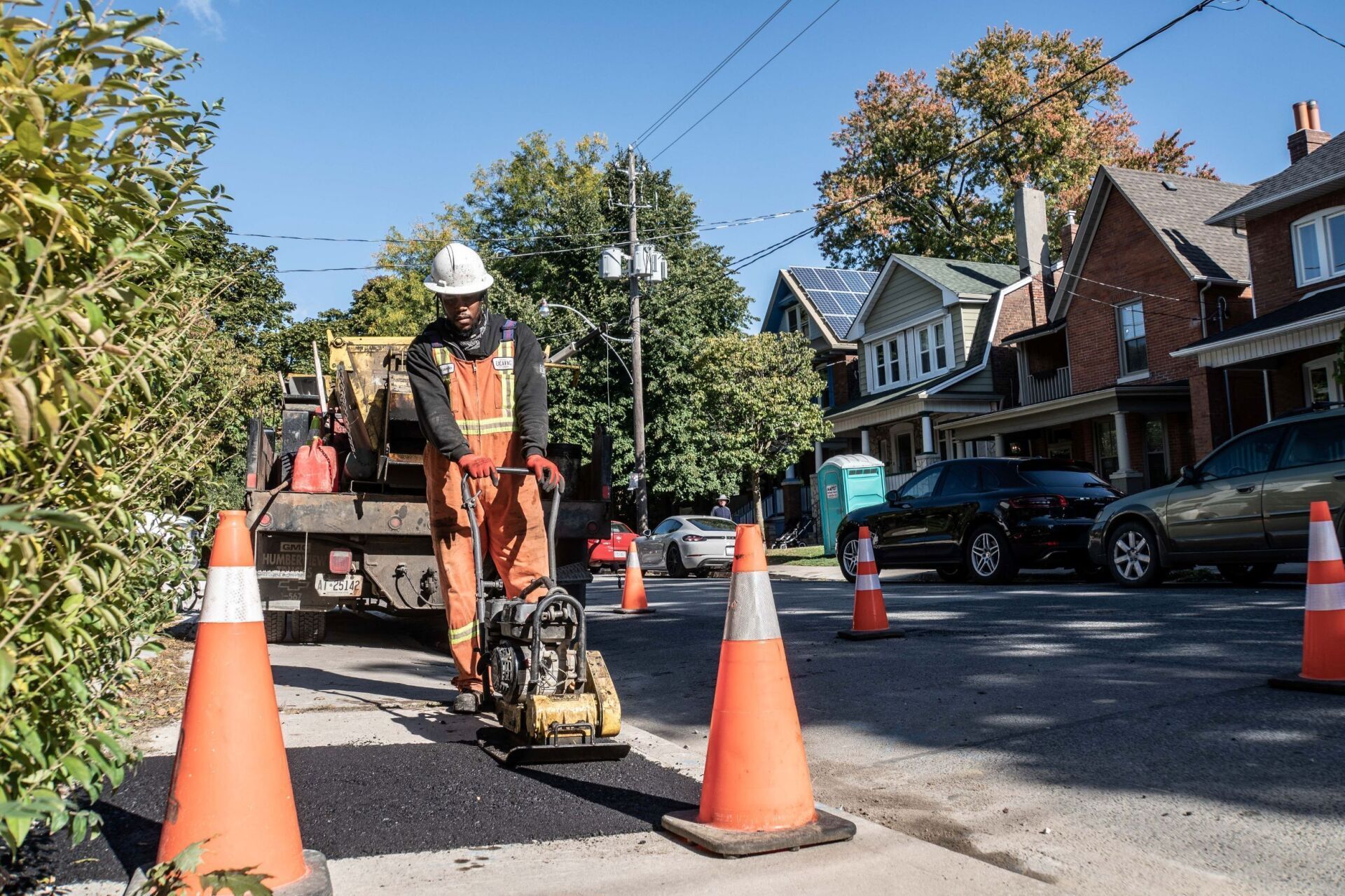 OE worker flattening asphalt